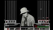 A person wearing a hat is seen at the center of the screen, depicted with monochrome colors over a black background. The left and right sides of the screen contain lanes for notes heading toward the controller's seven keys and turntable. The player's score and groove gauge are at the bottom side of the screen alongside a percentage accounting for the player's overall performance, a red dancer, the song's bpm, "surround", and "0/1 coin(s)".