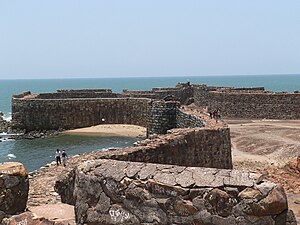 West side of fort showing a small beach and a door in the wall for beach access