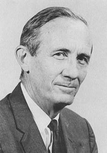 Black and white photograph of a Roberts wearing a suit towards the end of his life.