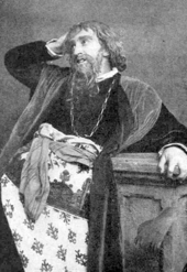 Actor in costume as Shylock, with long beard