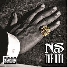 A hand is set down on a tablecloth: a gold ring is worn on the little finger, whilst the words "Nas" and "The Don" have been superimposed onto the bottom right-hand corner of the picture.