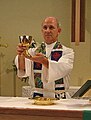 An ELCA pastor elevating the chalice