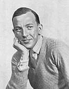 British playwright and actor Noel Coward in a jumper