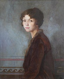 A young woman wearing a brown jacket looks over her left shoulder at the viewer; the painted background is gray and cloudy